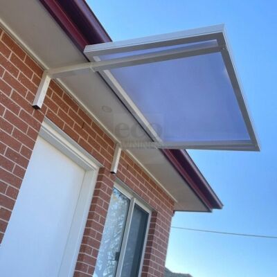 Slimline 50 under-eave awning mounted to a brick wall for shade, rain protection and a clean finish